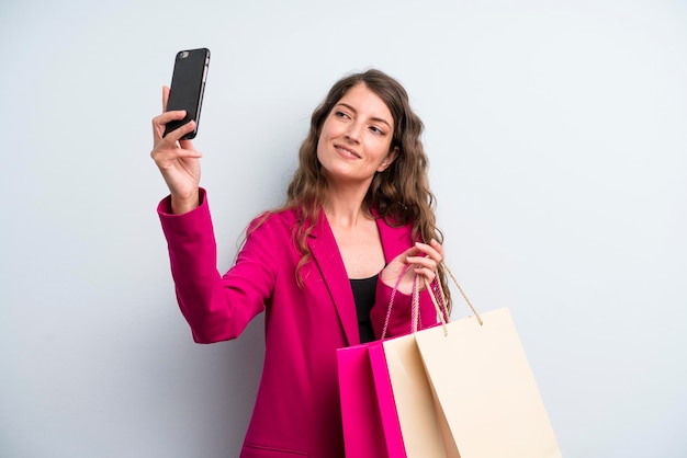 Young adult pretty woman with shopping bags