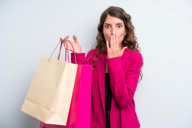 Young adult pretty woman with shopping bags