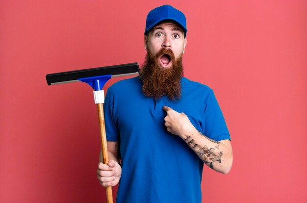 Premium Photo  Young adult red hair bearded cool man windows washer 