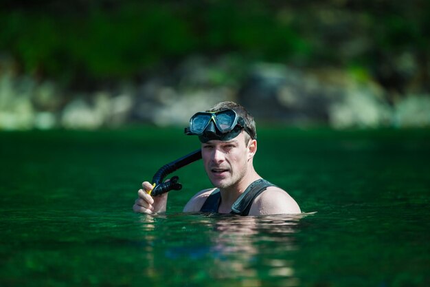 Young adult snorkeling in a river