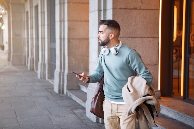 Young adult tourist waiting looking smart phone one person\
journey lifestyles transportation