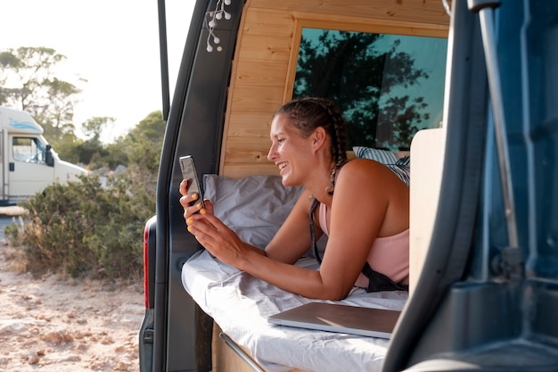 young adult using digital device while travelling