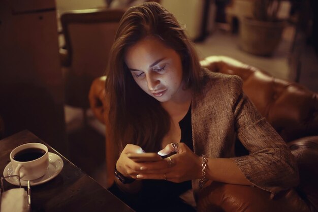 Young adult woman coffee telephone restaurant