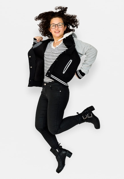 Young Adult Woman Jumping Studio Portrait