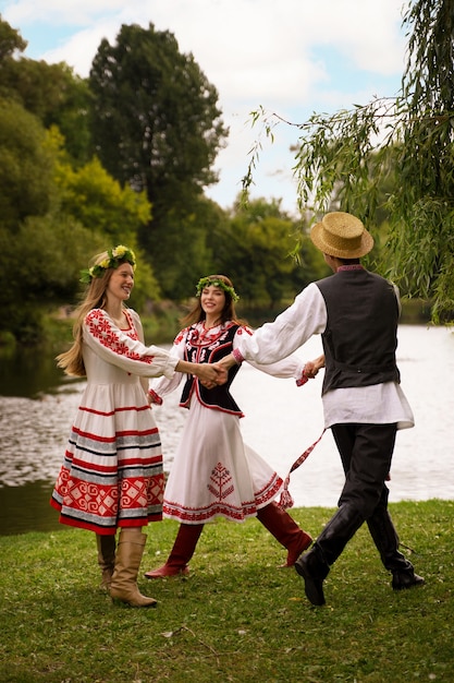 Young adults having fun while folk dancing