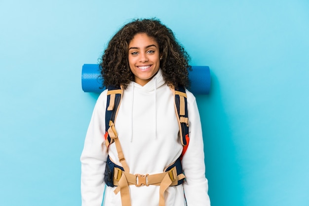 Young african american backpacker woman happy, smiling and cheerful.