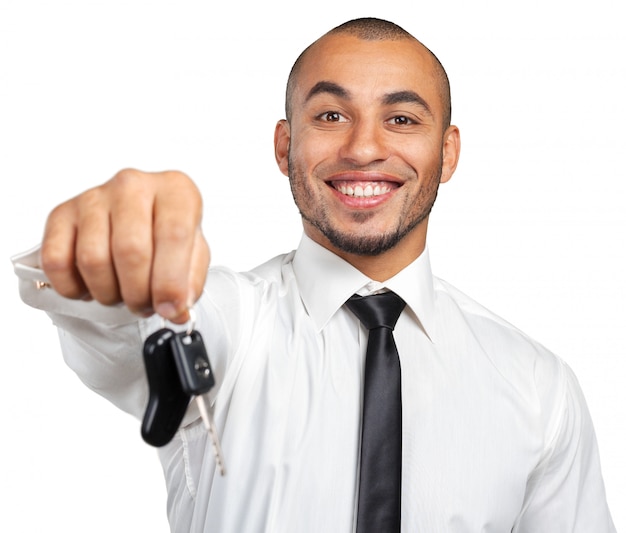 Young African American businessman holding a car key