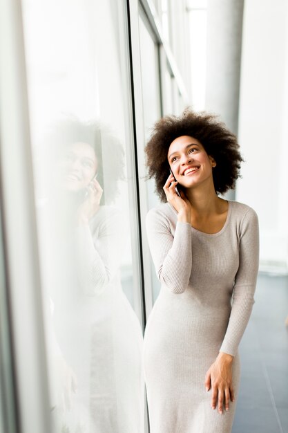 Young African American businesswoman using mobile phone