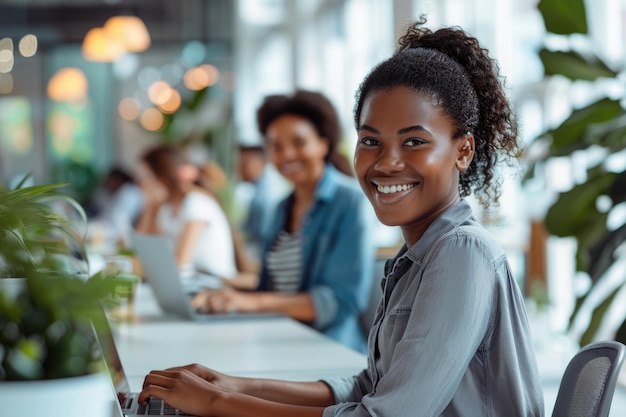 Young African American businesswoman working on laptop in modern office