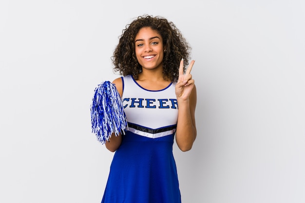 Young african american cheerleader woman isolated showing number two with fingers.