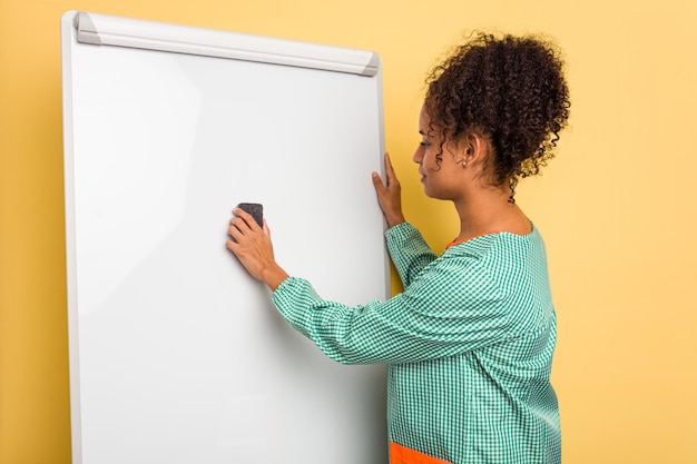 Young african american child education teacher explaining on the blackboard isolated