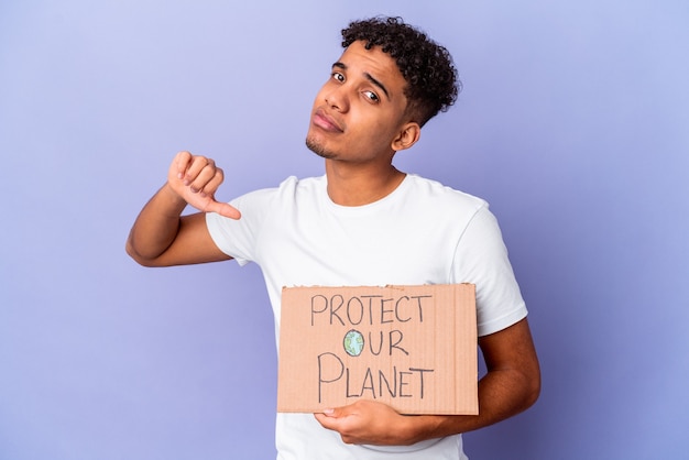 Young african american curly man isolated holding a protect our planet feels proud and self confident, example to follow.