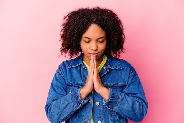 Young african american curly woman isolated expressing emotions