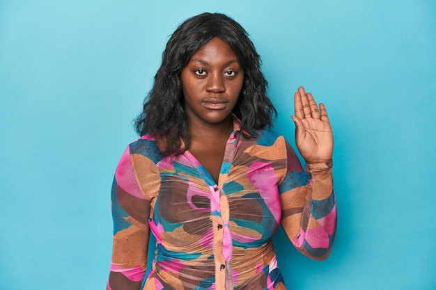 Young african american curvy woman smiling cheerful showing number five with fingers