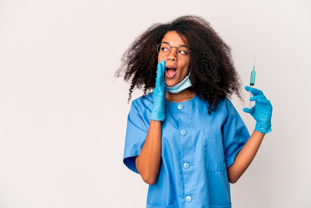 Young african american doctor woman holding an syringe