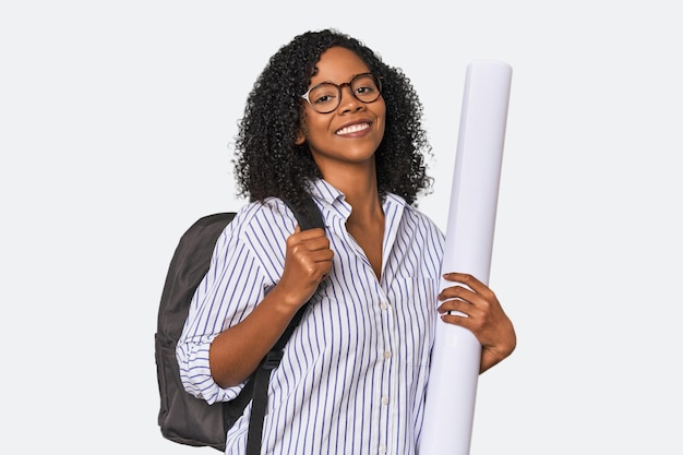 Photo young african american female architect with blueprint