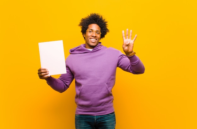 Young african american man  against orange background