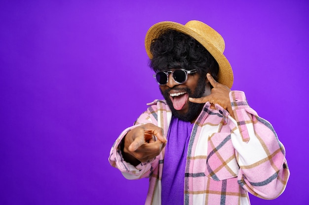 Young african american man doing talking on the telephone gesture