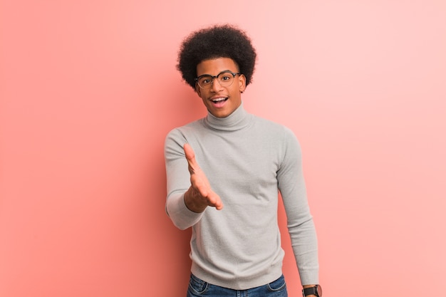 Young african american man greeting