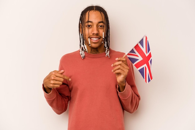 Young African American man holding a English flag isolated on white background person pointing by hand to a shirt copy space proud and confident