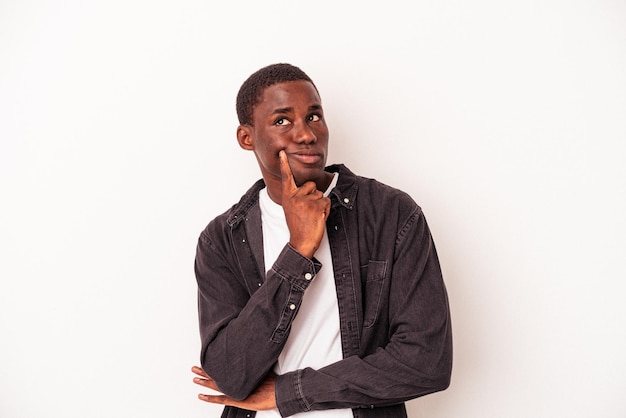 Young African American man isolated on white background contemplating planning a strategy thinking about the way of a business