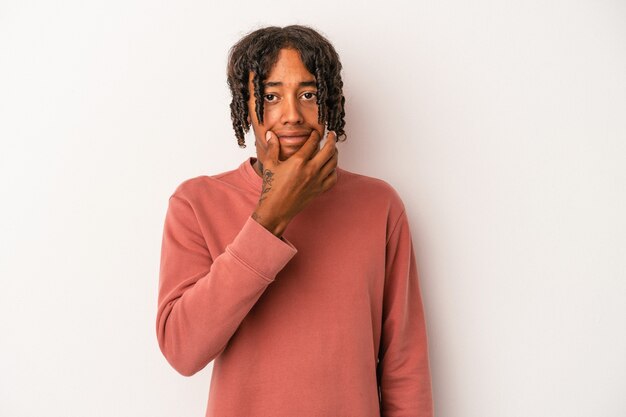 Photo young african american man isolated on white background doubting between two options.