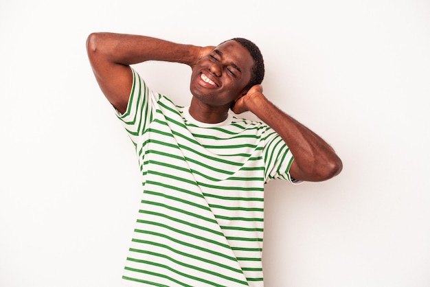 Young African American man isolated on white background feeling confident, with hands behind the head.