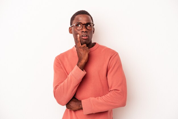 Young African American man isolated on white background having some great idea, concept of creativity.