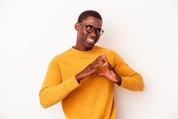 Young African American man isolated on white background making up plan in mind setting up an idea