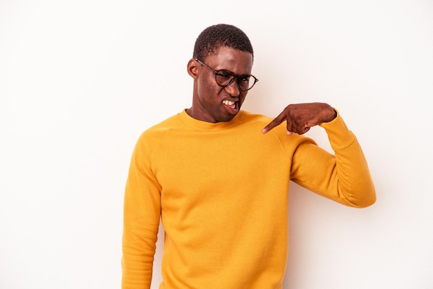 Young African American man isolated on white background person pointing by hand to a shirt copy space, proud and confident