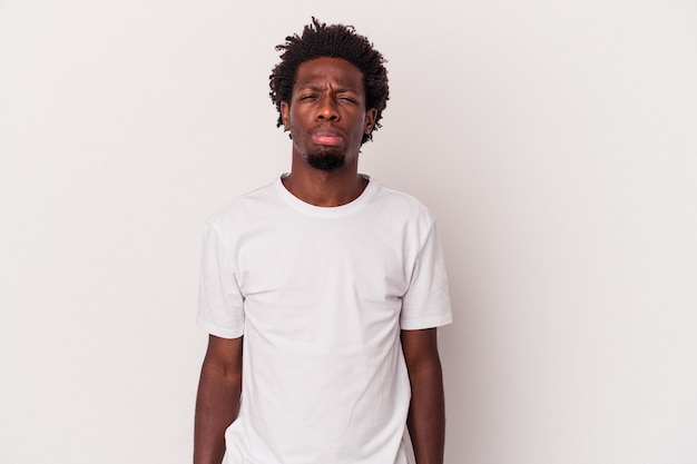 Young african american man isolated on white background  sad, serious face, feeling miserable and displeased.