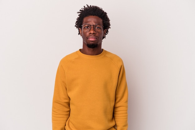 Young african american man isolated on white background  sad, serious face, feeling miserable and displeased.