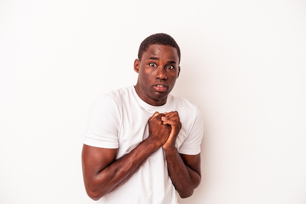 Young African American man isolated on white background scared and afraid.