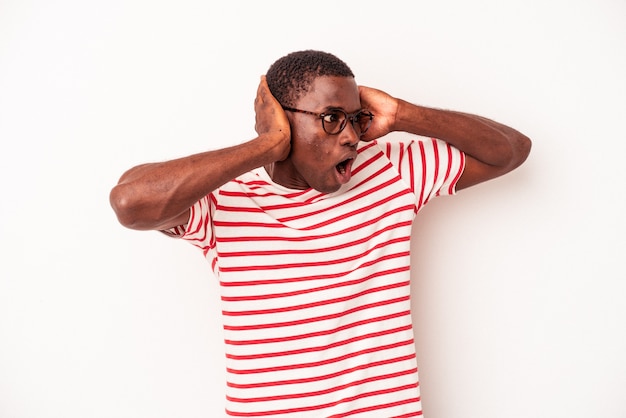 Young African American man isolated on white background screaming, very excited, passionate, satisfied with something.