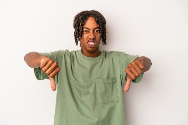 Young african american man isolated on white background showing thumb down and expressing dislike.