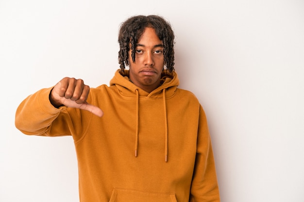 Young african american man isolated on white background showing thumb down and expressing dislike.