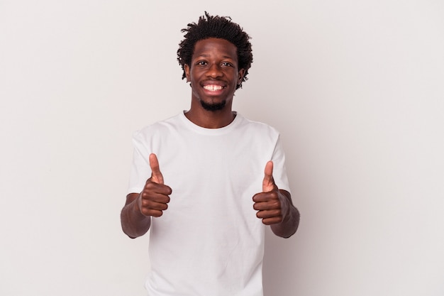 Photo young african american man isolated on white background  smiling and raising thumb up