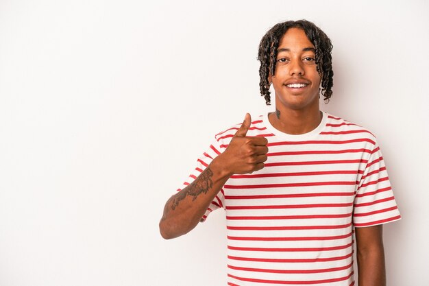 Young african american man isolated on white background smiling and raising thumb up