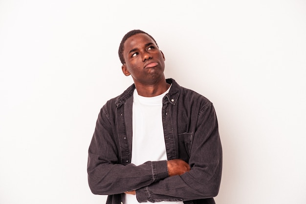 Young African American man isolated on white background tired of a repetitive task.