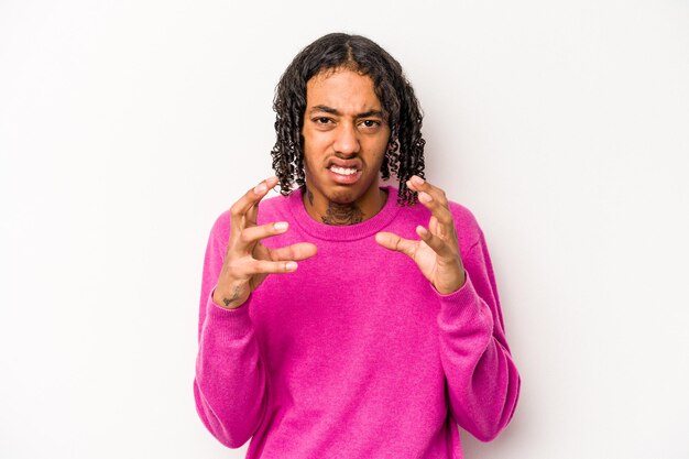 Young African American man isolated on white background upset screaming with tense hands