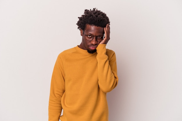 Young african american man isolated on white background  who feels sad and pensive, looking at copy space.