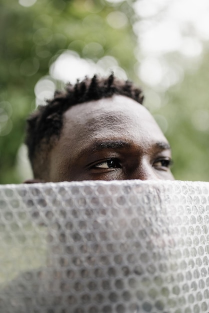 Young african american man portrait plastic pollution mental\
health concept