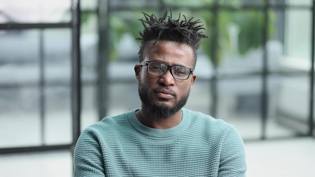 Young african american man showing quiet business