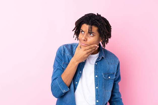 Young African American man over wall