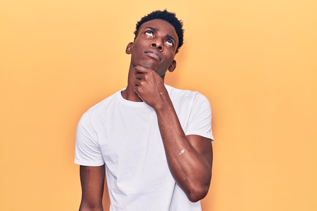 Young african american man wearing casual clothes touching painful neck, sore throat for flu, clod and infection