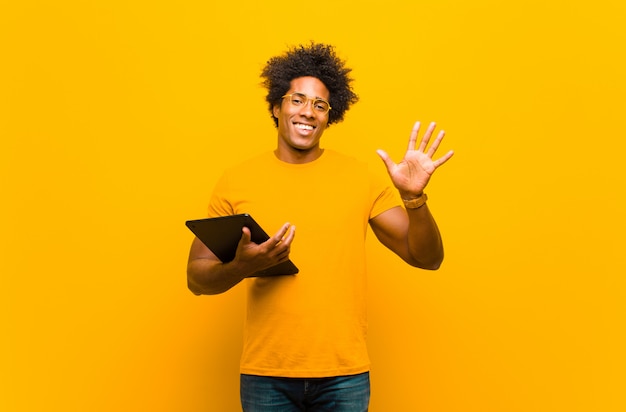 Young african american man with a tablet