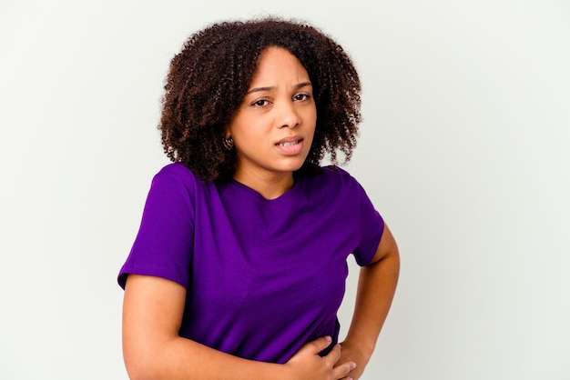 Young african american mixed race woman isolated having a liver pain, stomach ache.