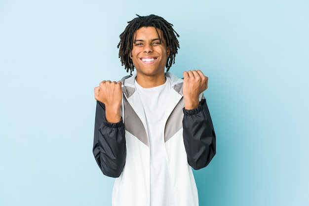 Young african american sport man cheering carefree and excited. Victory concept.