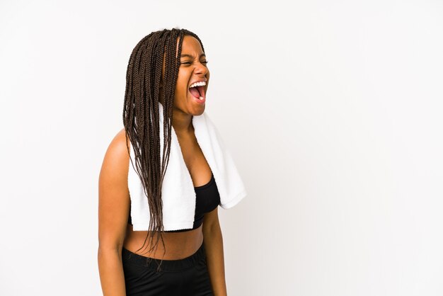 Young african american sport woman isolated shouting towards a copy space