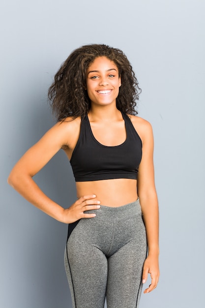 Young african american sporty woman posing